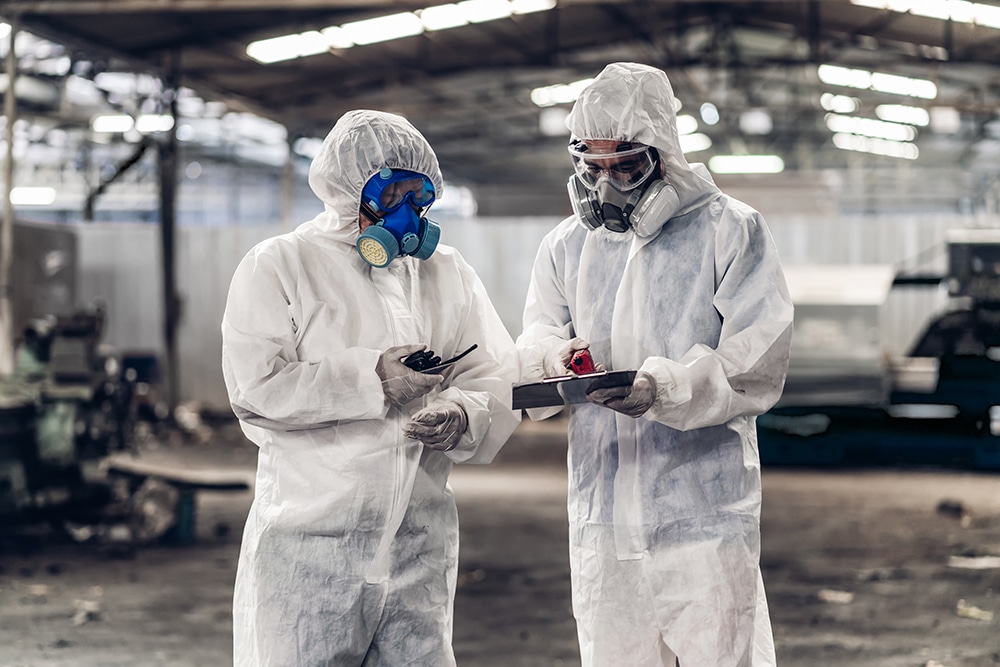 Scientist wear Chemical protection suit check danger chemical w